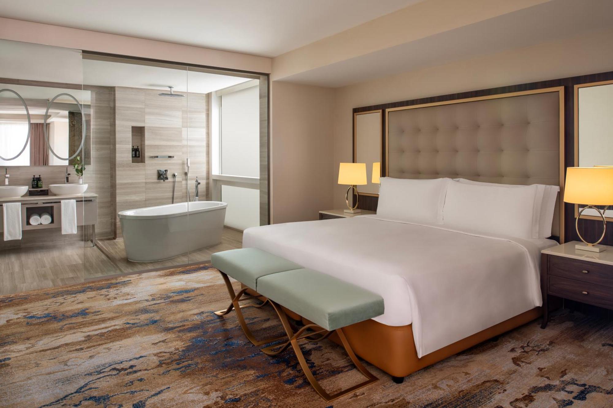 Dusit Doha Hotel Exteriér fotografie A bedroom at the hotel